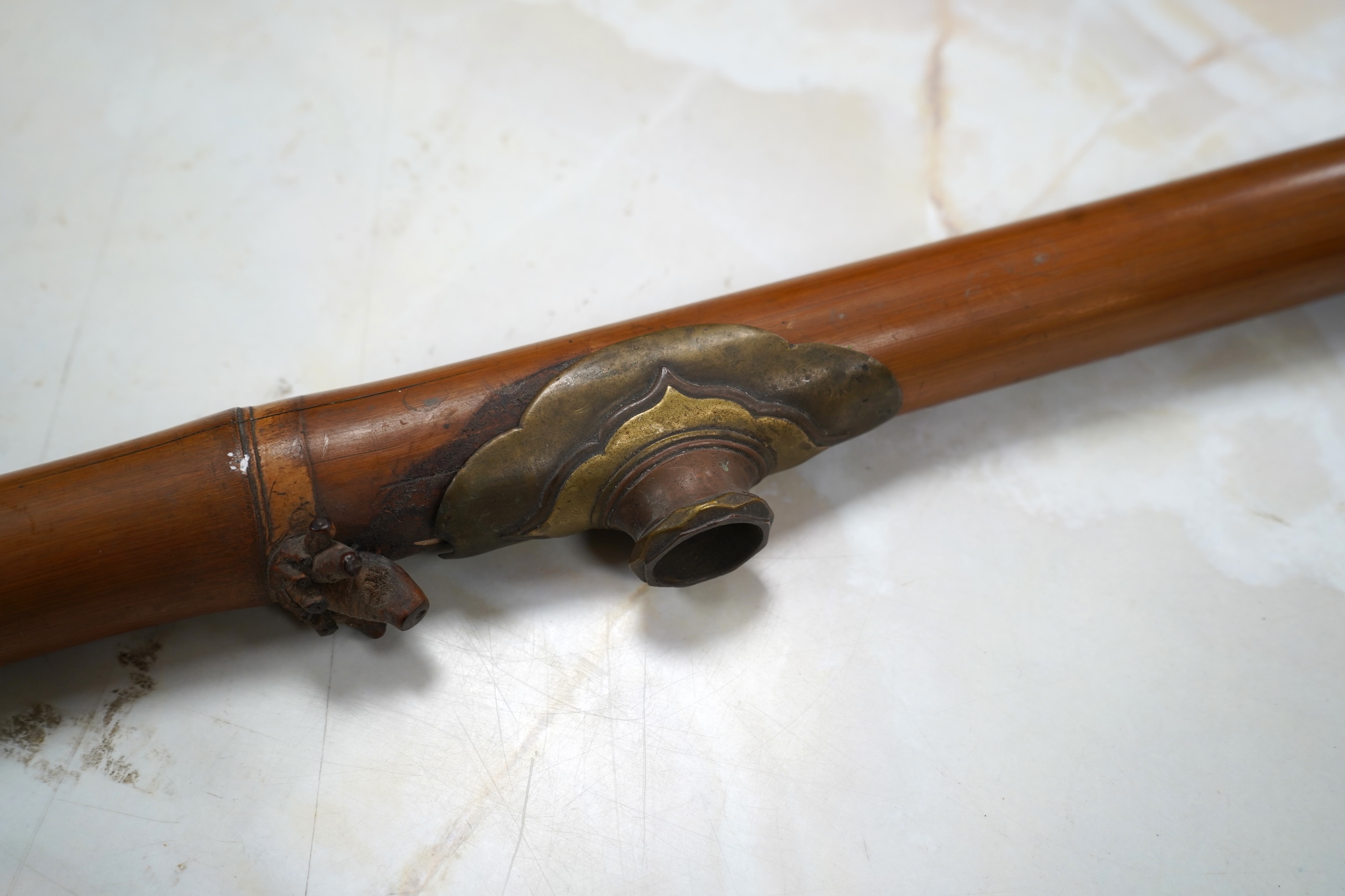 A 19th century bamboo and ivory mounted opium pipe, 58cm in length CITES Submission reference 7T1VK7KR